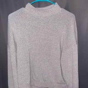 Woman’s half turtle neck gray sweater